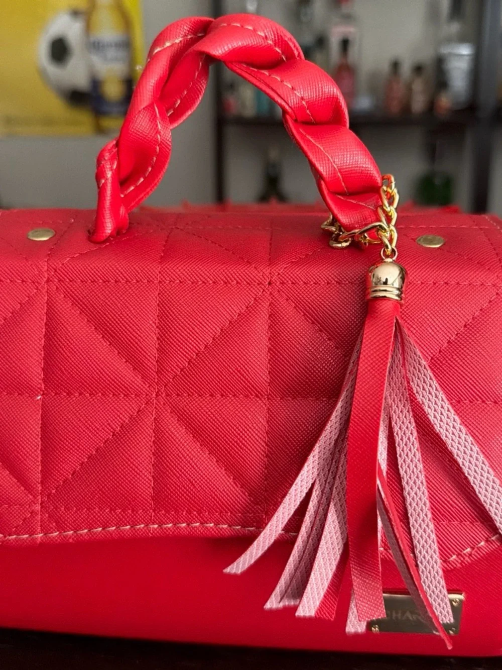 Quilted Red Crossbody Bag with Braided Handle and Tassel